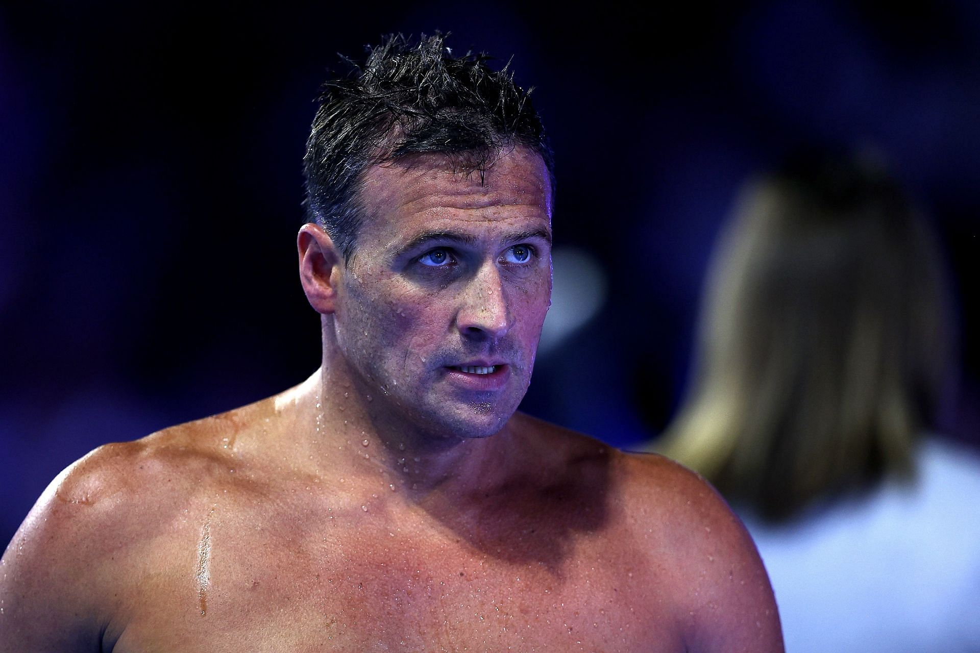 Ryan Lochte reacts after competing in a semifinal heat for the Men's 200m individual medley